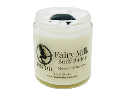 white body butter packaged in a glass 4 oz jar topped with a moss agate. Label reads: Fairy Milk Body Butter. Flowers & Berries.