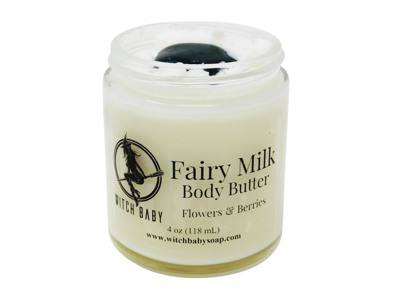 white body butter packaged in a glass 4 oz jar topped with a moss agate. Label reads: Fairy Milk Body Butter. Flowers & Berries.