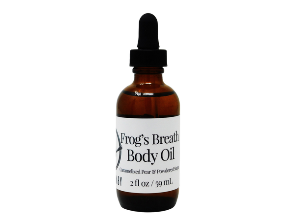 brown glass dropper bottle with white label that reads: Frog's Breath Body Butter. Caramelized Pear & Powdered Sugar. 