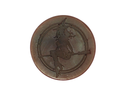 circular brown soap with witch baby logo on top