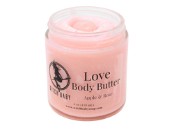 pink body butter packaged in glass jar with label that reads: Love Body Butter. Roses - Apples - Magick.