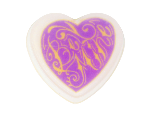 heart shaped soap with illustration  of purple heart with yellow tattoo style  script that says be mine