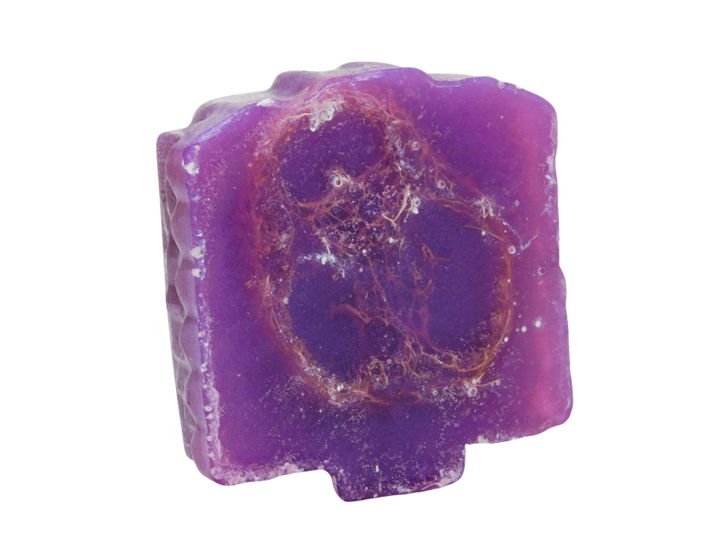 bottom of purple soap showcasing the loofah embed. 