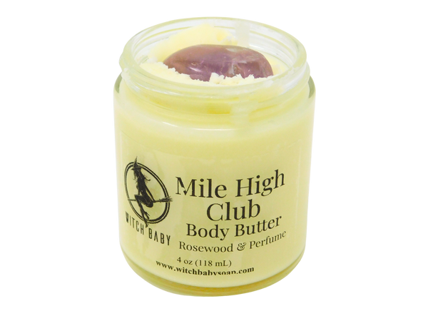yellow body butter in 4 oz glass jar with a label that reads: Mile High Club Body Butter. Rosewood & Perfume. 