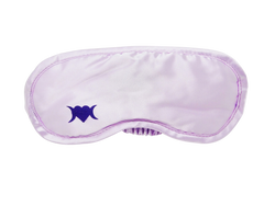 Photo of light lilac colored sleep mask with a symbol on the bottom left corner that is a heart with two crescent moons.