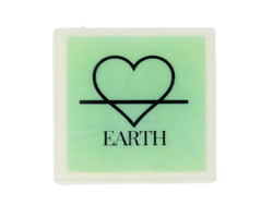 Square white soap with green image with the symbol of the earth element (but fashioned to be a heart instead of a triangle) and the word EARTH beneath