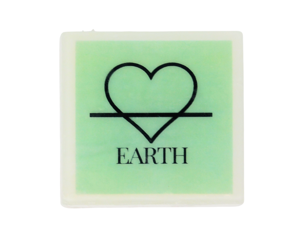 Square white soap with green image with the symbol of the earth element (but fashioned to be a heart instead of a triangle) and the word EARTH beneath