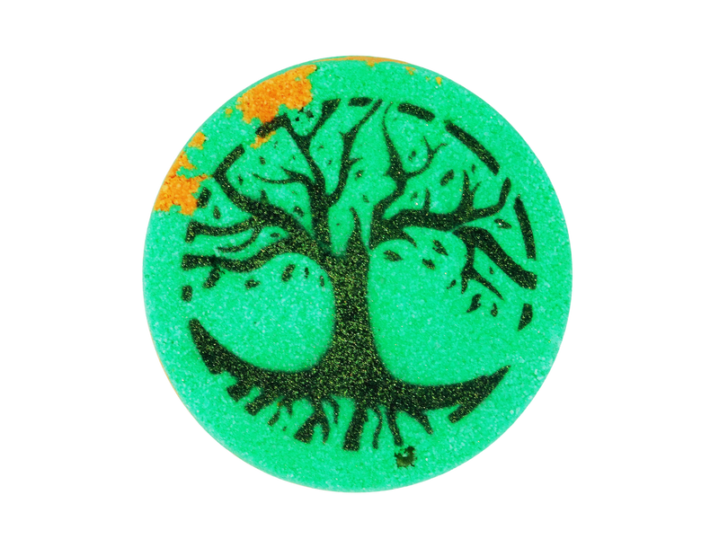 green circular bath bomb with splotches of orange and a tree airbrushed on top