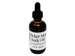 2 oz brown glass dropper bottle with white label that reads: Wicker Man Body Oil. Rosewood & Green Musk.