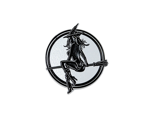 white enamel pin with witch baby logo 